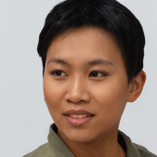 Joyful asian young-adult female with short  black hair and brown eyes