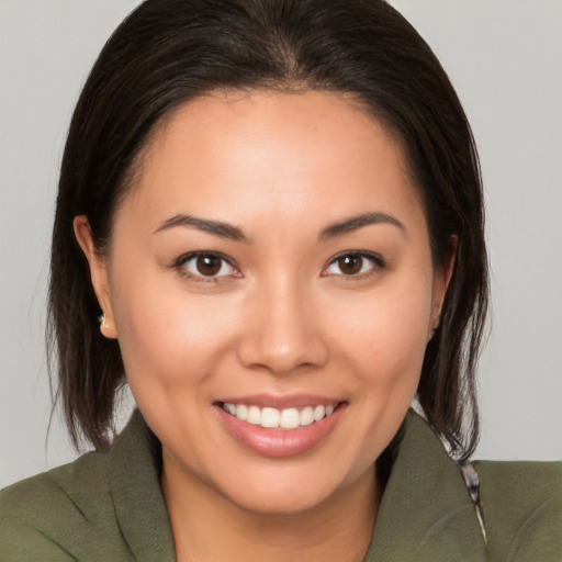 Joyful white young-adult female with medium  brown hair and brown eyes