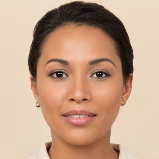 Joyful latino young-adult female with short  brown hair and brown eyes