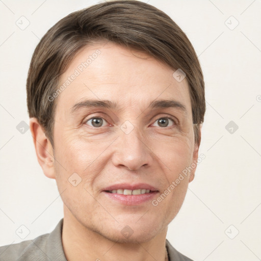 Joyful white adult male with short  brown hair and grey eyes