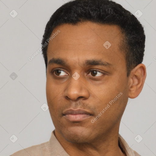 Neutral latino young-adult male with short  black hair and brown eyes