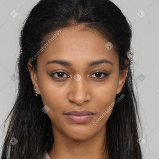 Joyful black young-adult female with long  brown hair and brown eyes