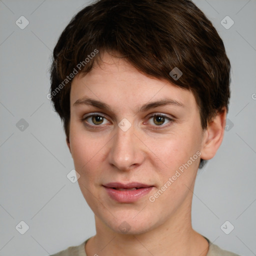 Joyful white young-adult female with short  brown hair and grey eyes