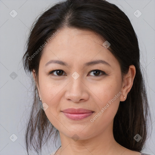 Joyful asian young-adult female with medium  brown hair and brown eyes