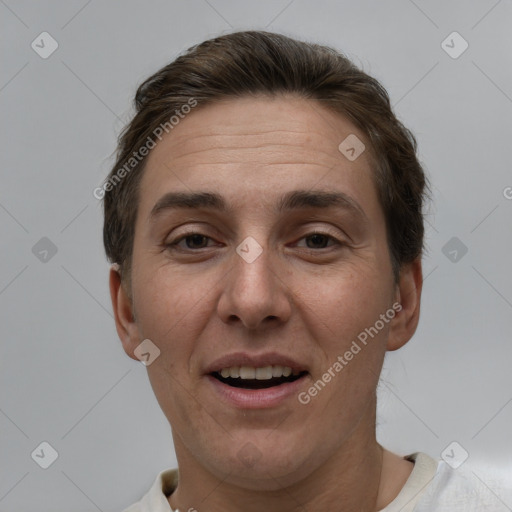 Joyful white adult male with short  brown hair and brown eyes