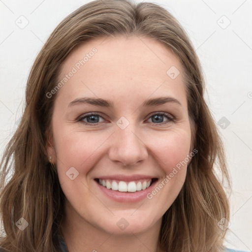 Joyful white young-adult female with long  brown hair and grey eyes