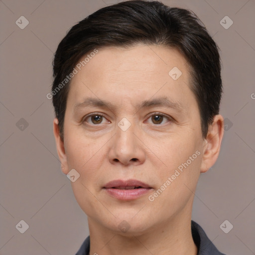 Joyful white adult female with short  brown hair and brown eyes