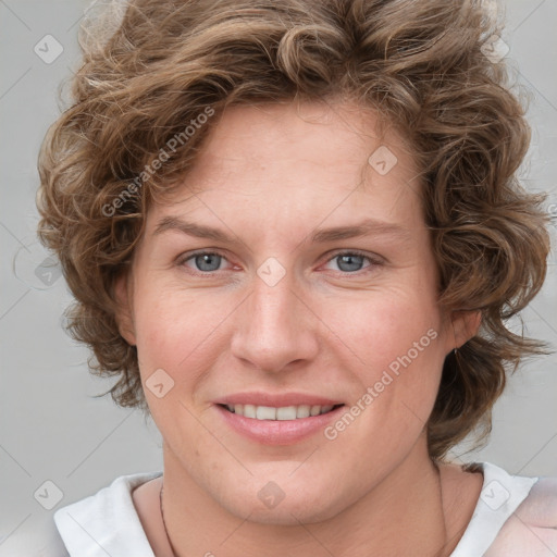 Joyful white young-adult female with medium  brown hair and blue eyes