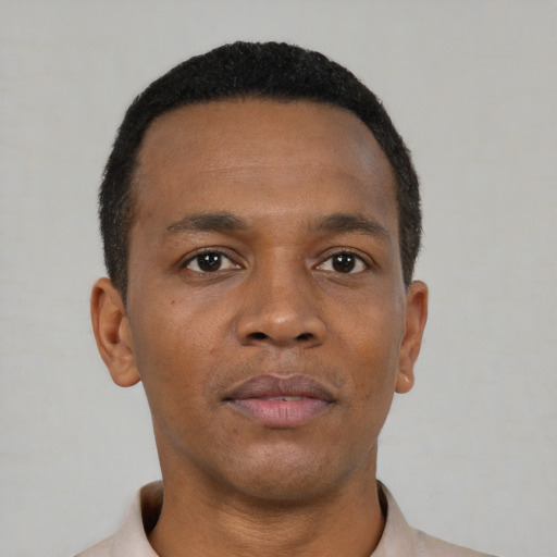Neutral black young-adult male with short  brown hair and brown eyes