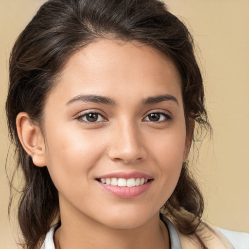 Joyful white young-adult female with medium  brown hair and brown eyes