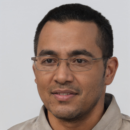 Joyful asian adult male with short  black hair and brown eyes
