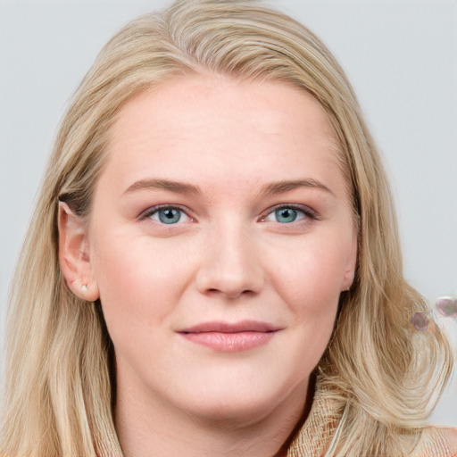 Joyful white young-adult female with long  brown hair and blue eyes