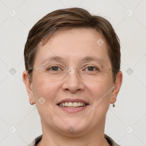 Joyful white adult female with short  brown hair and grey eyes