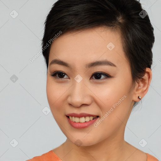 Joyful asian young-adult female with short  brown hair and brown eyes