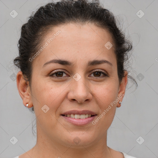 Joyful white adult female with short  brown hair and brown eyes