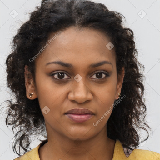 Joyful black young-adult female with long  brown hair and brown eyes