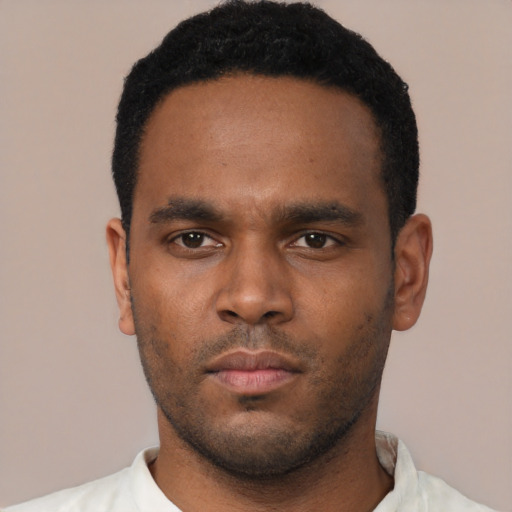Neutral black young-adult male with short  black hair and brown eyes