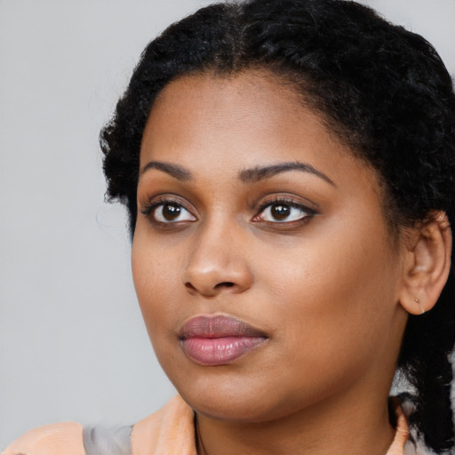 Neutral black young-adult female with long  black hair and brown eyes