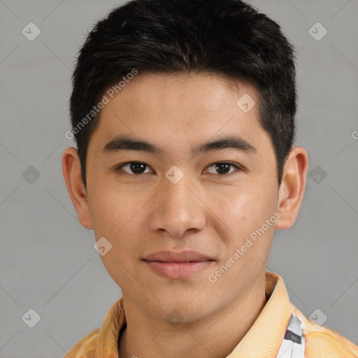 Joyful asian young-adult male with short  brown hair and brown eyes