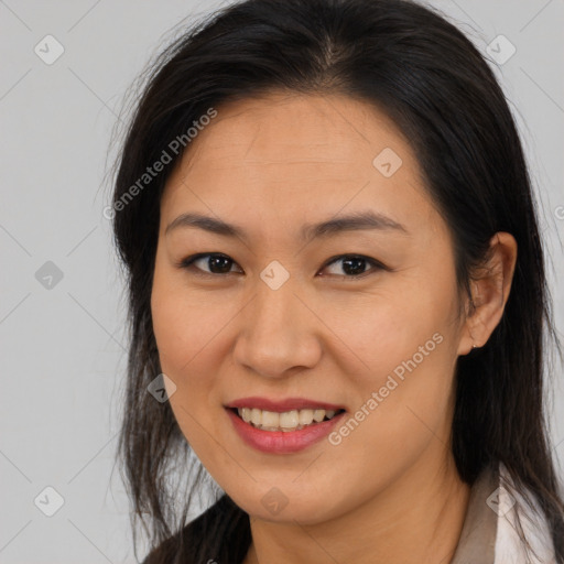 Joyful asian young-adult female with long  brown hair and brown eyes