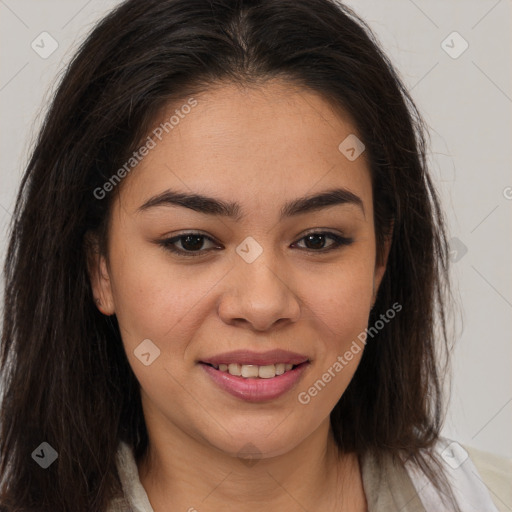 Joyful latino young-adult female with long  brown hair and brown eyes