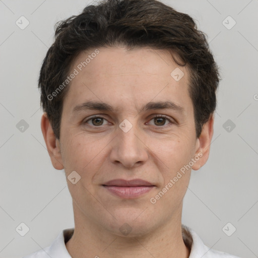 Joyful white adult male with short  brown hair and brown eyes