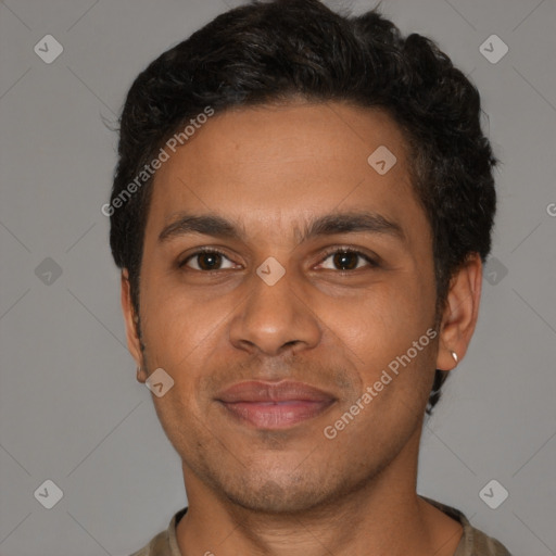 Joyful latino young-adult male with short  brown hair and brown eyes