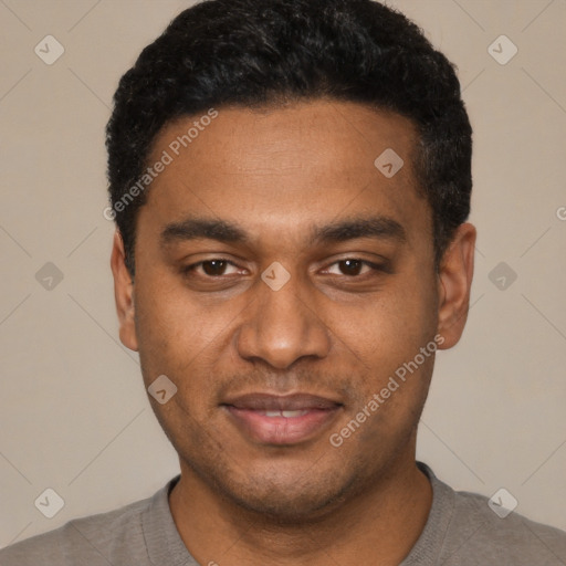 Joyful black young-adult male with short  black hair and brown eyes