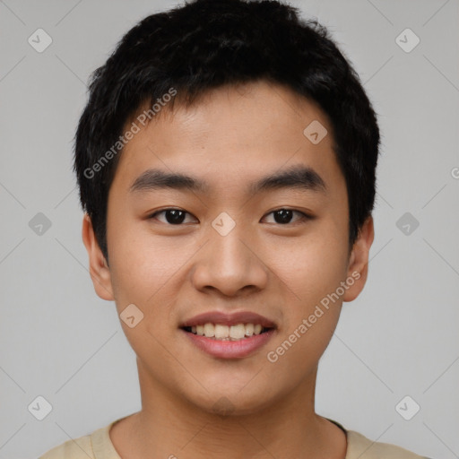 Joyful asian young-adult male with short  black hair and brown eyes