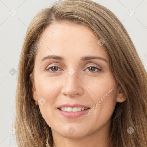 Joyful white young-adult female with long  brown hair and grey eyes