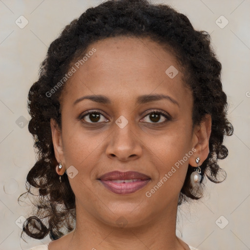 Joyful black young-adult female with medium  brown hair and brown eyes