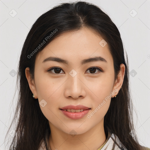 Joyful asian young-adult female with long  brown hair and brown eyes