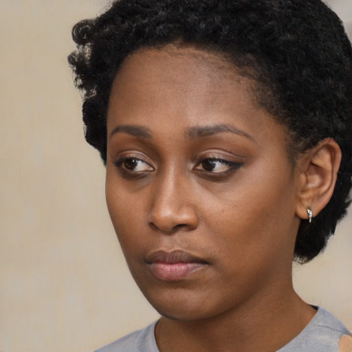 Neutral black young-adult female with short  black hair and brown eyes