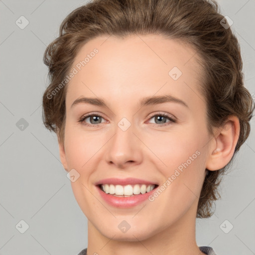 Joyful white young-adult female with medium  brown hair and green eyes