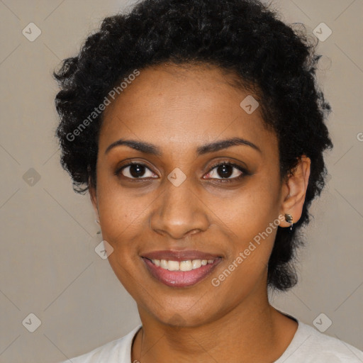 Joyful black young-adult female with short  black hair and brown eyes