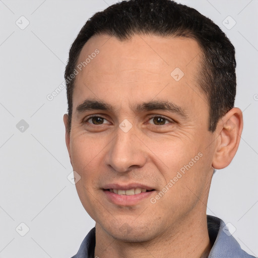 Joyful white young-adult male with short  brown hair and brown eyes