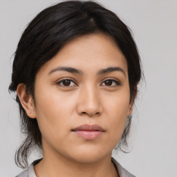 Neutral asian young-adult female with medium  brown hair and brown eyes