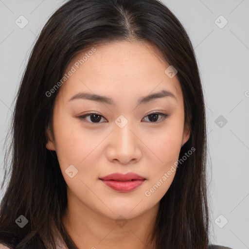 Joyful asian young-adult female with long  brown hair and brown eyes