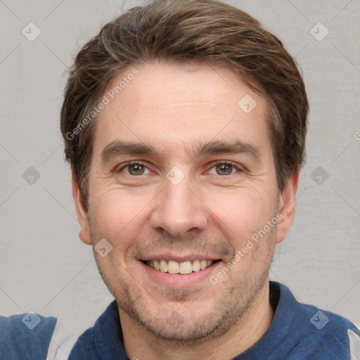 Joyful white adult male with short  brown hair and grey eyes