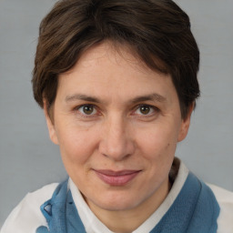 Joyful white adult female with short  brown hair and brown eyes