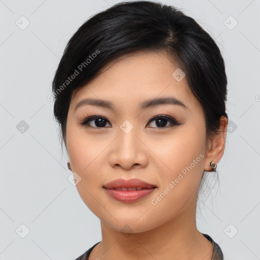 Joyful asian young-adult female with medium  black hair and brown eyes