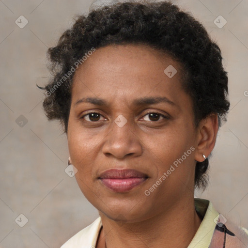 Joyful black adult female with short  brown hair and brown eyes