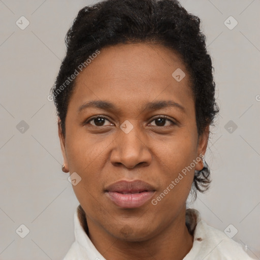 Joyful black adult female with short  brown hair and brown eyes