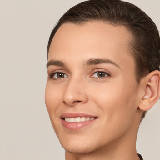 Joyful white young-adult female with short  brown hair and brown eyes