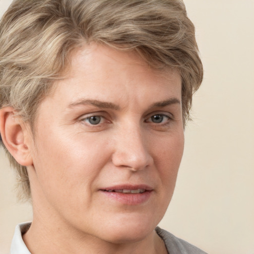 Joyful white adult female with short  brown hair and grey eyes