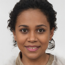 Joyful black young-adult female with medium  brown hair and brown eyes