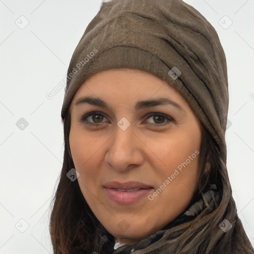 Joyful latino young-adult female with long  brown hair and brown eyes