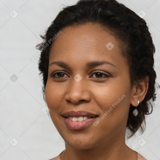 Joyful latino young-adult female with long  brown hair and brown eyes