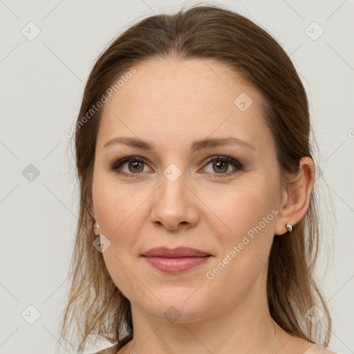 Joyful white young-adult female with long  brown hair and grey eyes