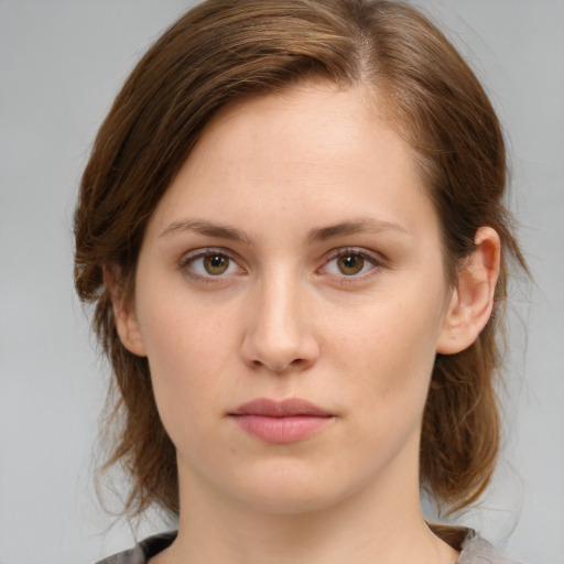 Neutral white young-adult female with medium  brown hair and green eyes